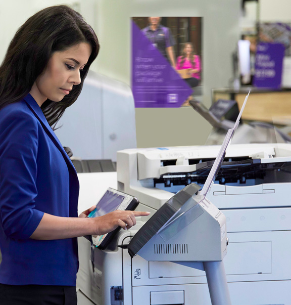 Photo of a woman making copies